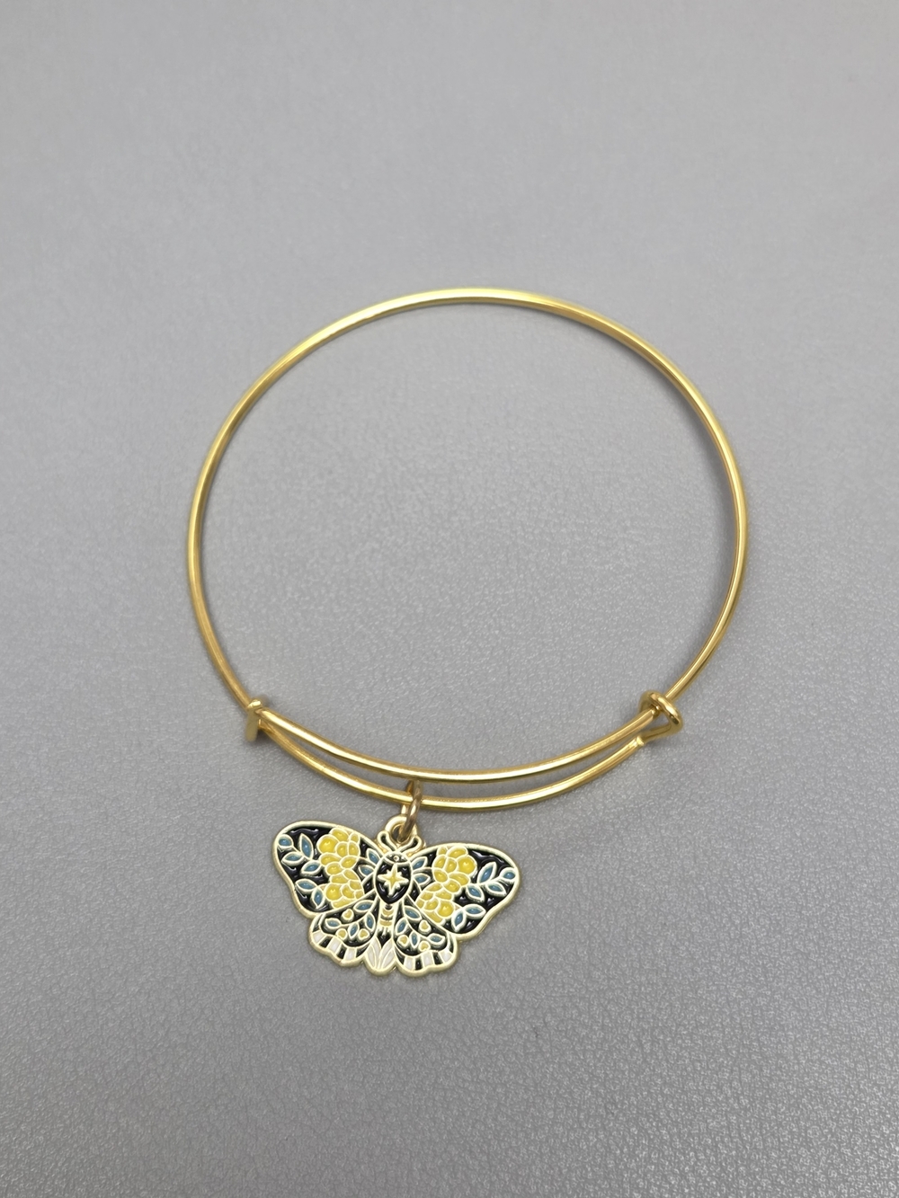 Gold Butterfly Charm Bangle Bracelet with Yellow Enamel Accent